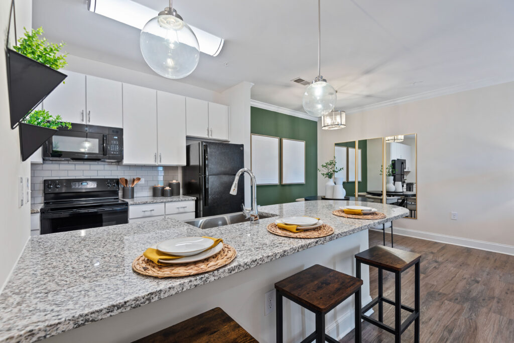 Kitchen with granite counter tops and bar height seating